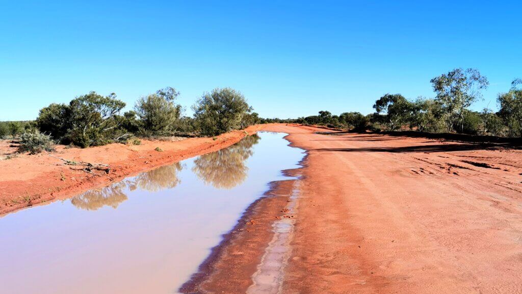Typical of the Toona Gate Road, 2023: lots of water along one side