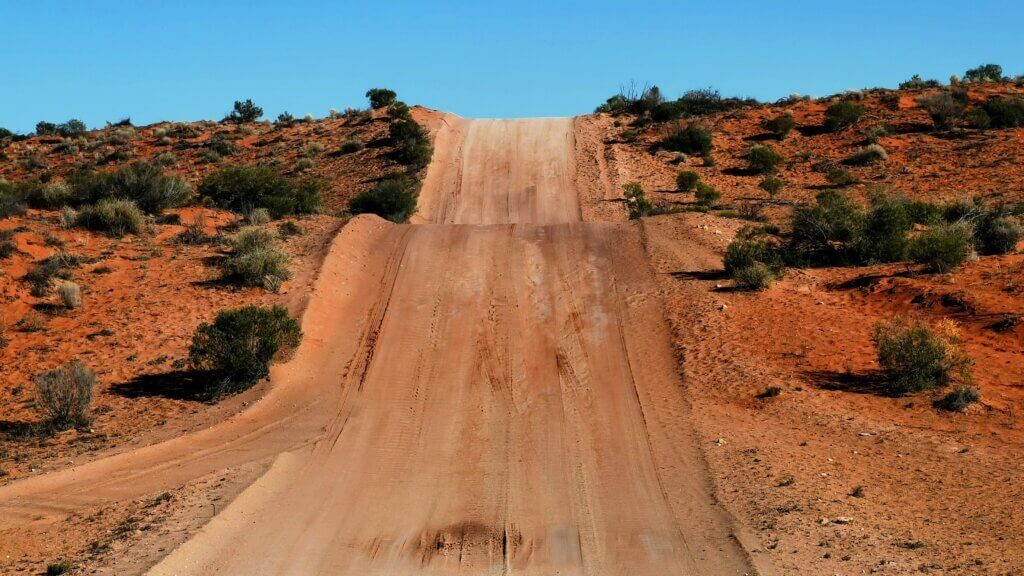 Crossing the Strzelecki Desert sand ridges was energy sapping work. The image shows a perfectly straight track undulating its way up a hill