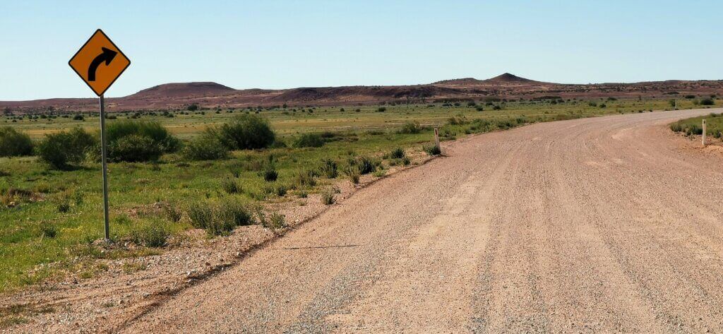 the sandy road bears right around a bend. other than that, I'm surroundeed by barren landscape