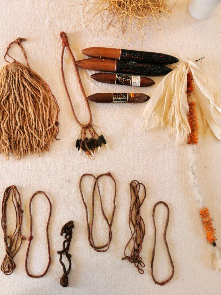 Some ceremonial items including necklaces, feathers and tassles