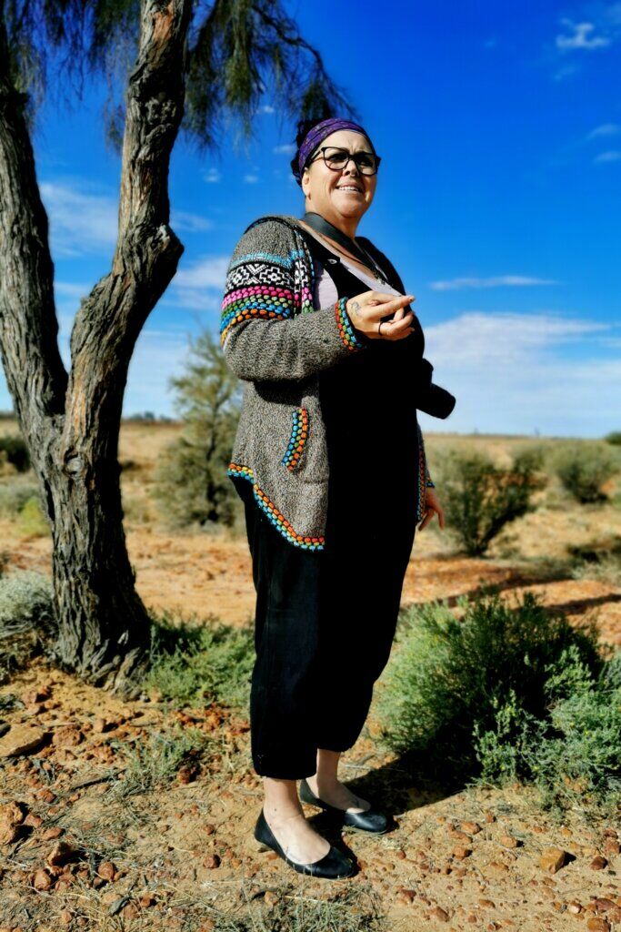 Peta standing in front of the Waddi trees she is telling us about