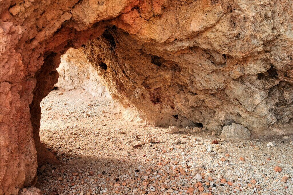 Looking inside a dingo cave in the red rock