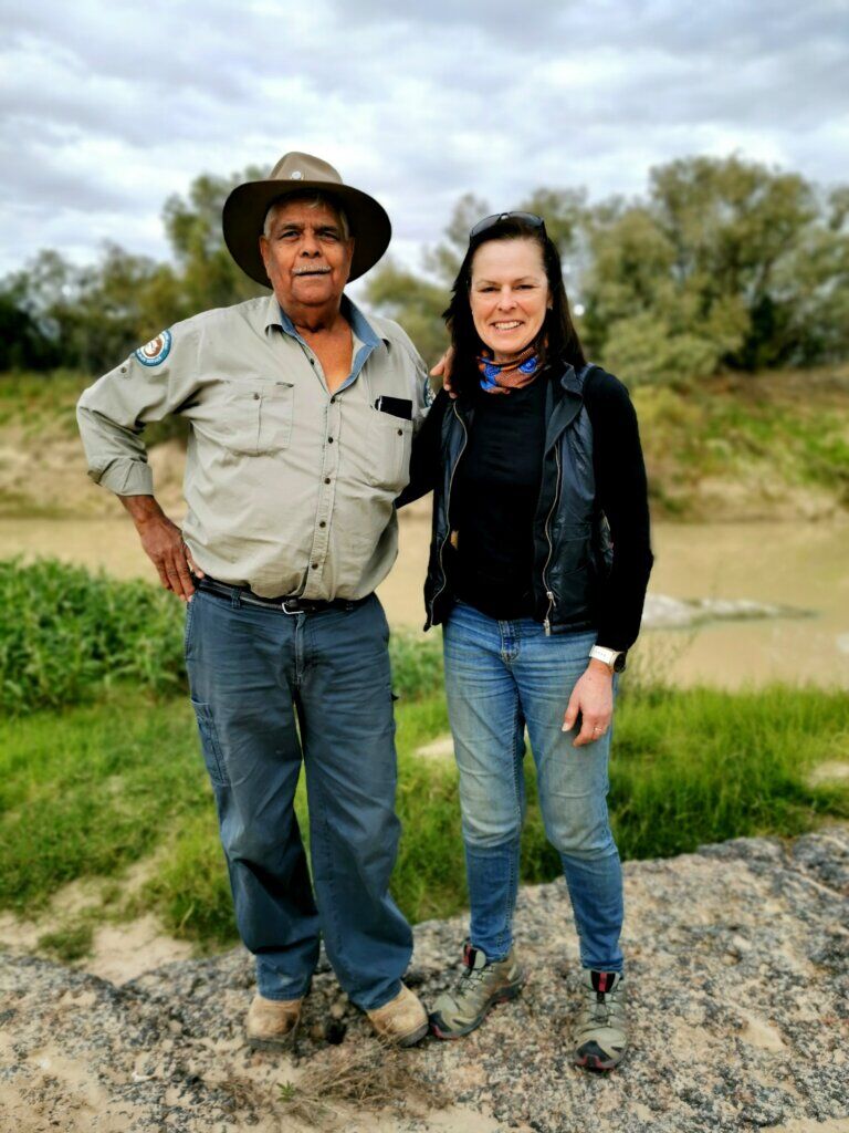 Don and Kate standing in front of the Two Boys (the rocks behind us) in the Diamantine River