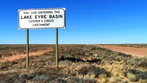 Nothing as far as teh eye can see excepöt for a solitary sign reading welcome to the Eyre Basin