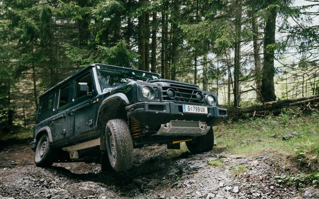 ineos grenadier stretching its legs - axle articulation in forest