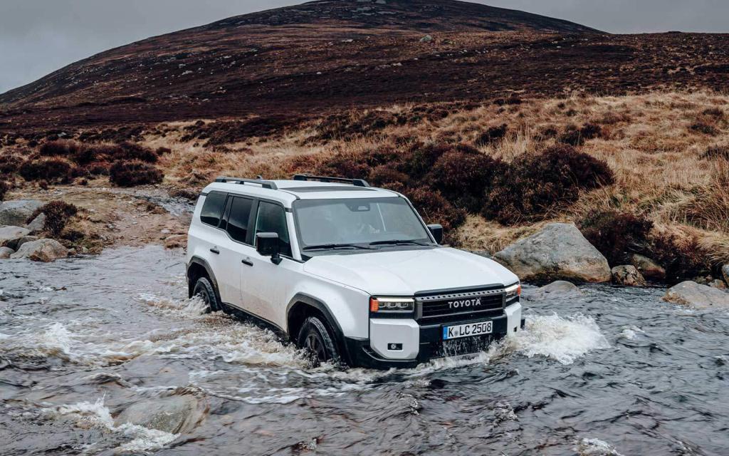 2024 land cruiser 250 wading through a river