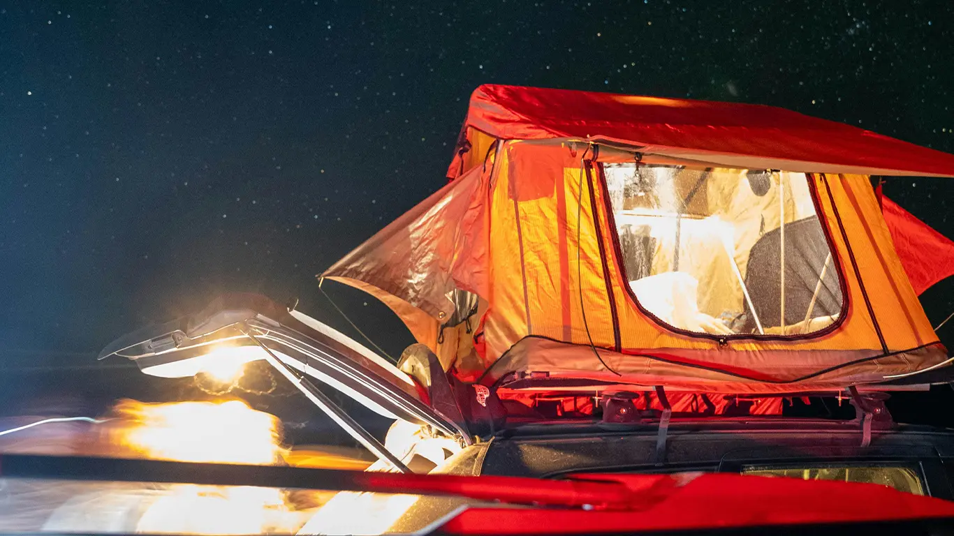 rooftop tent at night