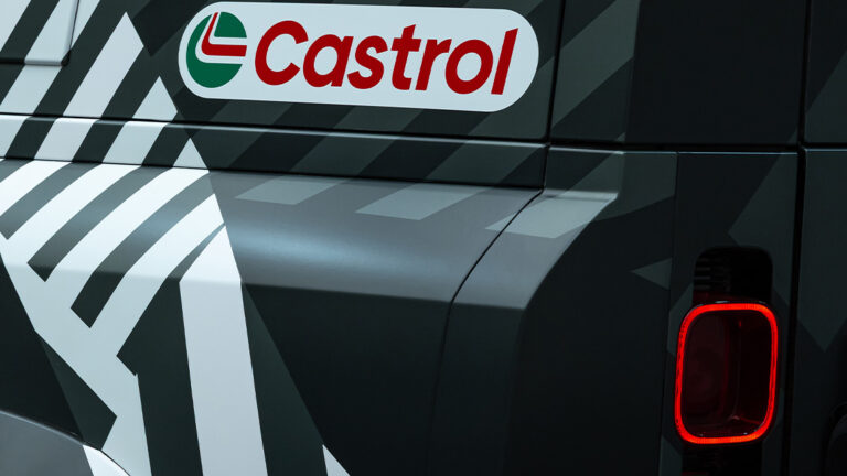 rear quarter of a new defender with the castrol logo