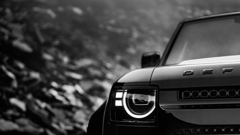detail shot of the new defender front showing the headlamp and the first three letters D E F