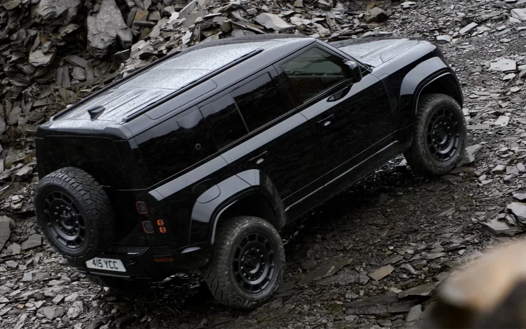 profile shot of the new defender octa black on a stony background