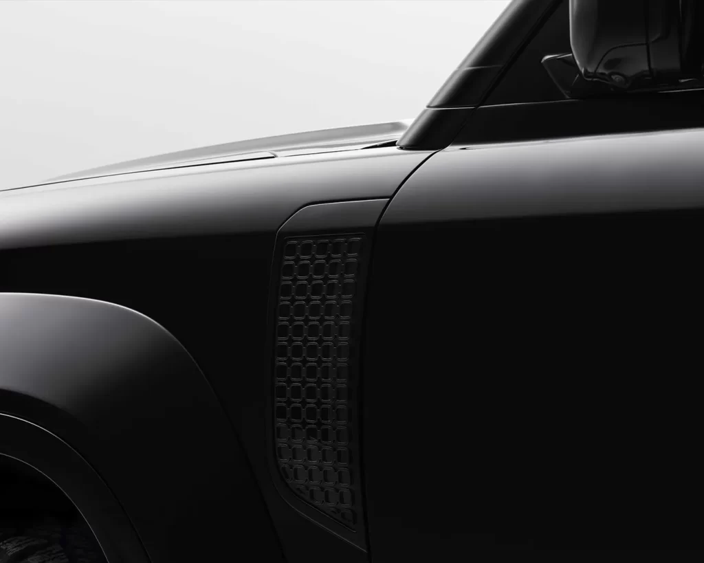 close up of new defender octa body panel behind front wheel arch