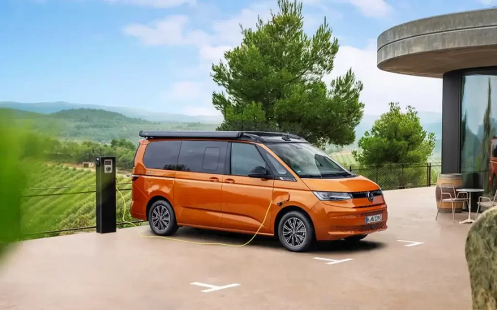 The California Beach Energy standing in a car park and hooked up to charge