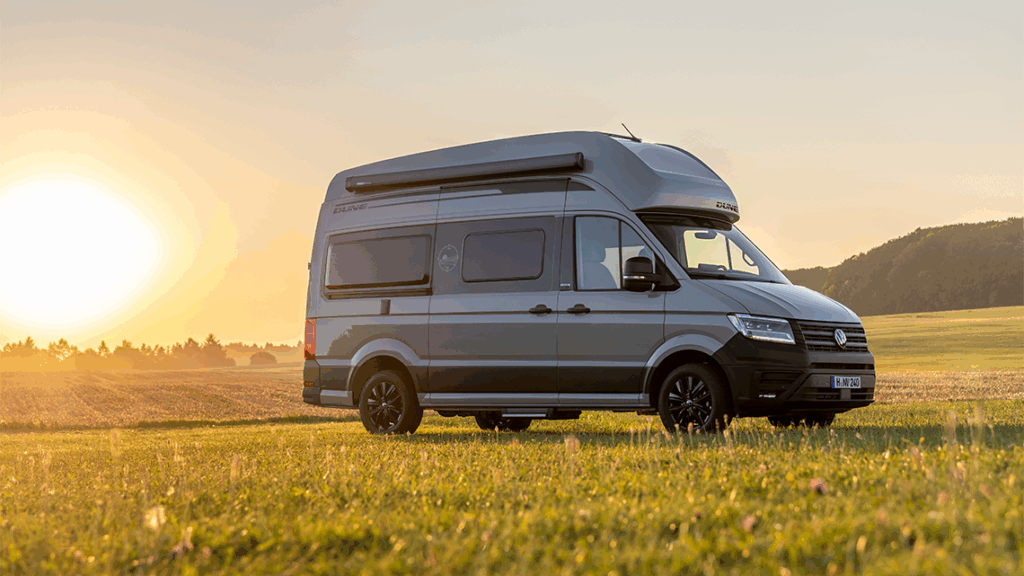 Grand California Dune 600 on a meadow with a setting sun in the background