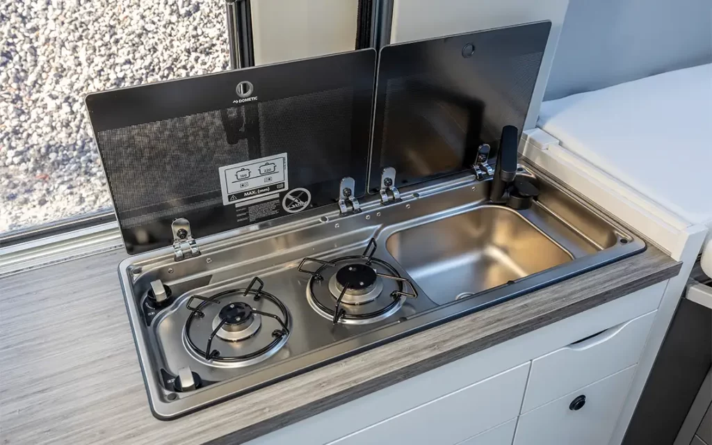 stove and kitchen basin in the VW Grand California 600