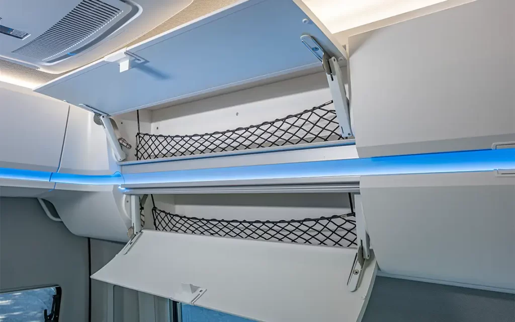 Luggage nets in the wall units make it easy to store clothes and utensils