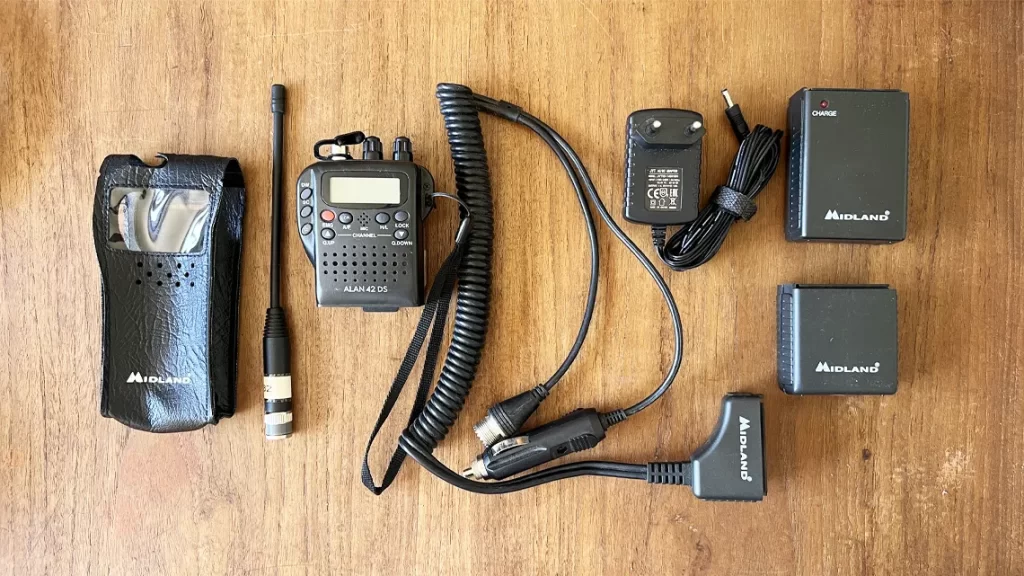 Midland Alan 42 DS CB radio set with pouch, battery packs, flixi-antenna, and in-car adapter kit