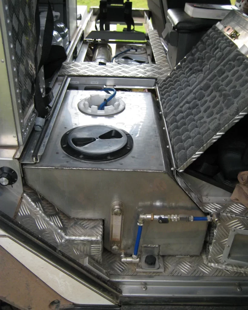 Tank in the rear foot well