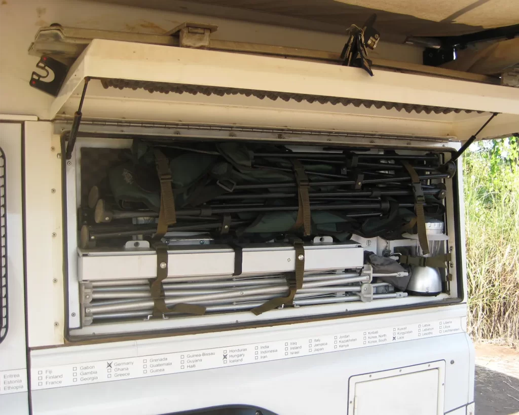 rear side locker open showing camping chairs neatly stowed